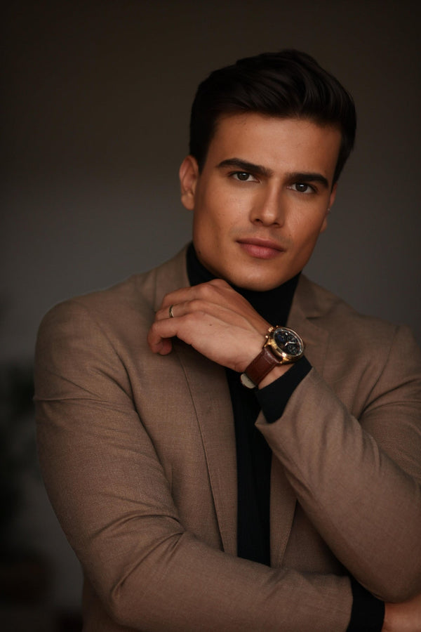 Stylish man posing for a professional men’s photoshoot in elegant attire