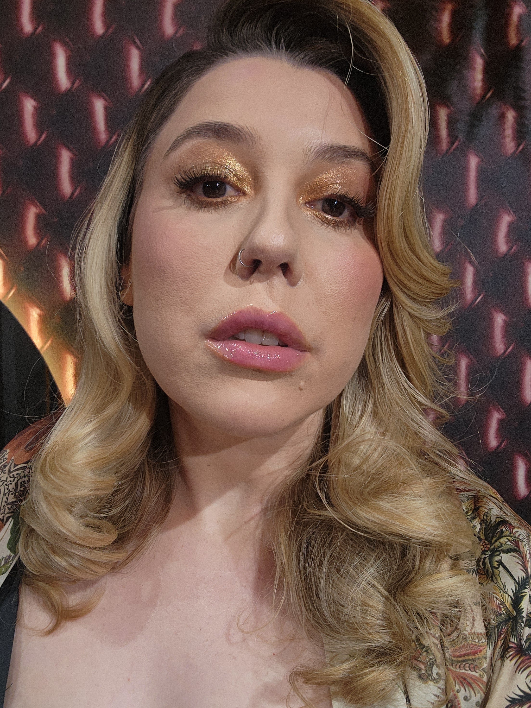 Professional makeup artist applying eyeshadow to a woman